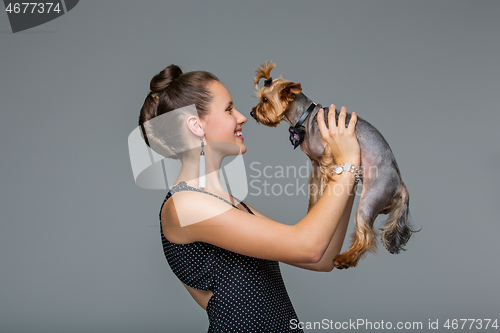 Image of Girl with yorkie dog