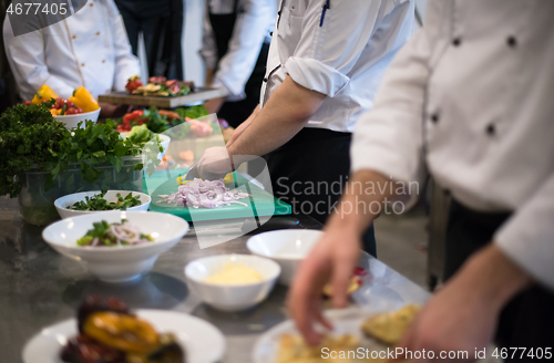 Image of team cooks and chefs preparing meal