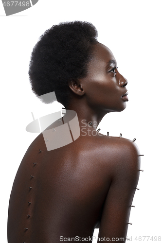 Image of Beautiful black girl with metal pins
