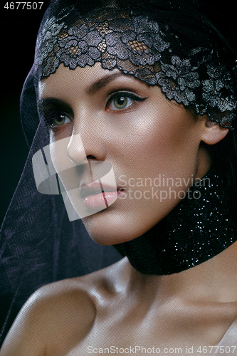 Image of Beautiful girl with black lace veil