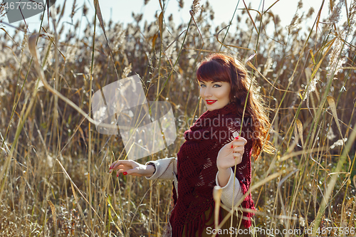 Image of Beautiful girl outdoors in countryside