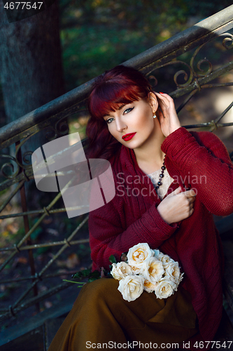 Image of Girl sitting on old house stairs