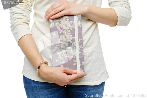 Image of beautiful scrapbooking folder in woman hand