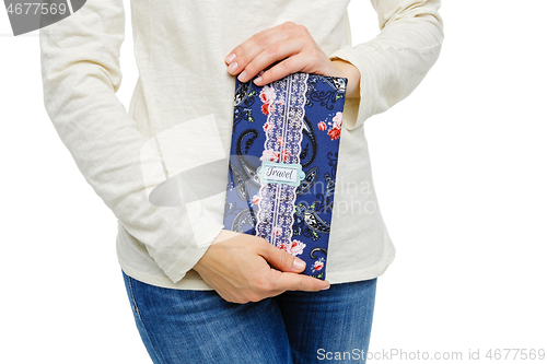 Image of beautiful scrapbooking folder in woman hand