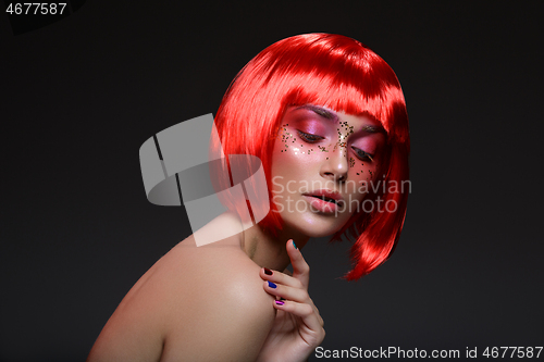 Image of Beautiful girl in red wig