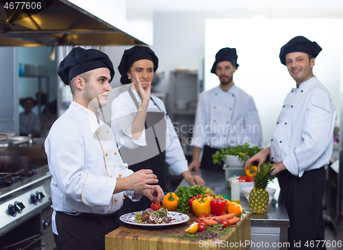 Image of team cooks and chefs preparing meals