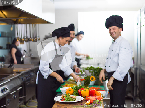 Image of team cooks and chefs preparing meals