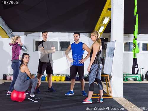 Image of athletes getting instructions from trainer