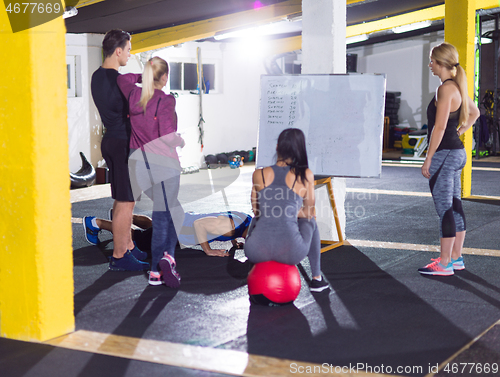 Image of athletes getting instructions from trainer