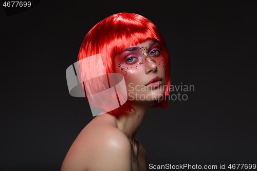 Image of Beautiful girl in red wig