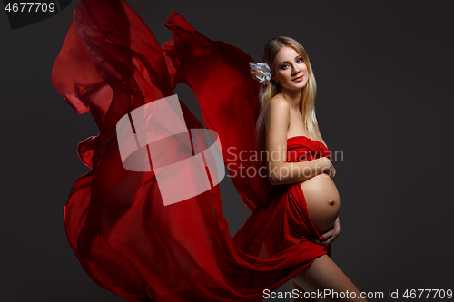 Image of Pregnant girl in red dress