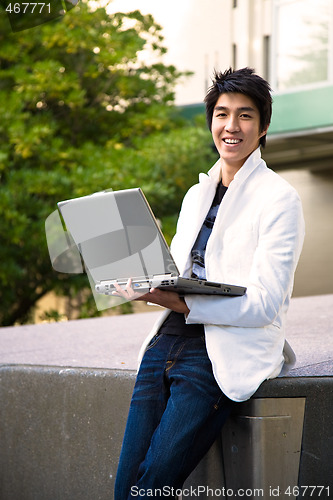 Image of Asian college student with laptop