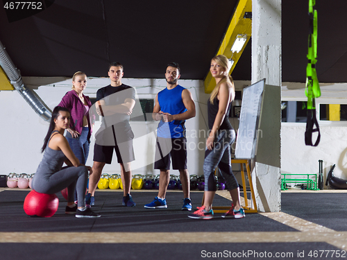 Image of athletes getting instructions from trainer