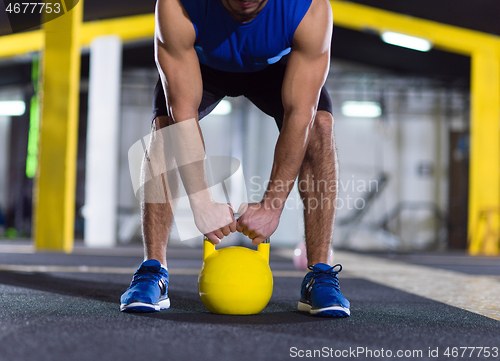 Image of man exercise with fitness kettlebell