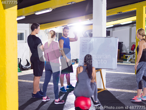 Image of athletes getting instructions from trainer