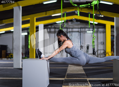 Image of woman working out gymnastic exercise on fit boxes