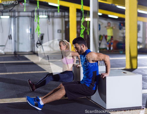 Image of athletes working out their arms