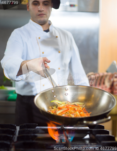 Image of Chef doing flambe on food