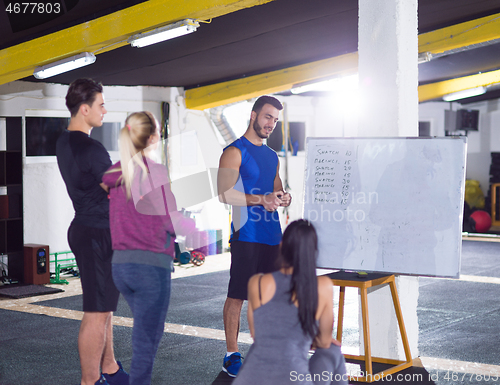 Image of athletes getting instructions from trainer