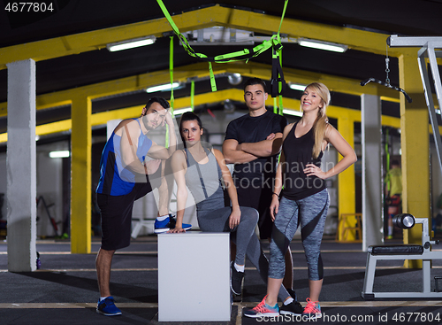 Image of portrait of athletes working out  jumping on fit box