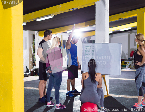 Image of athletes getting instructions from trainer