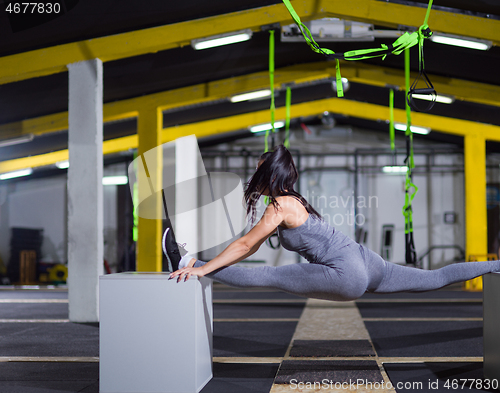 Image of woman working out gymnastic exercise on fit boxes