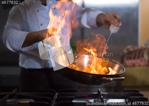 Image of Chef doing flambe on food