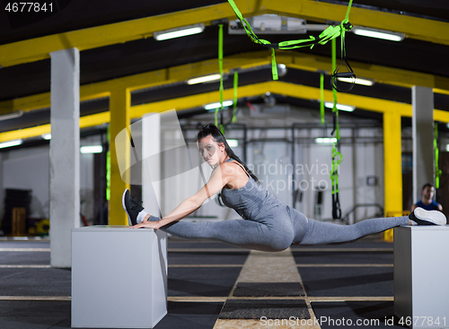Image of woman working out gymnastic exercise on fit boxes