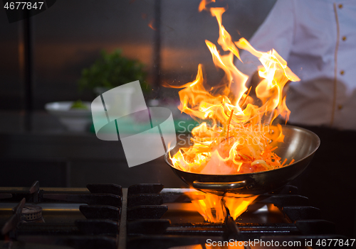 Image of Chef doing flambe on food