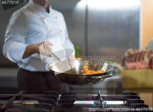 Image of Chef doing flambe on food