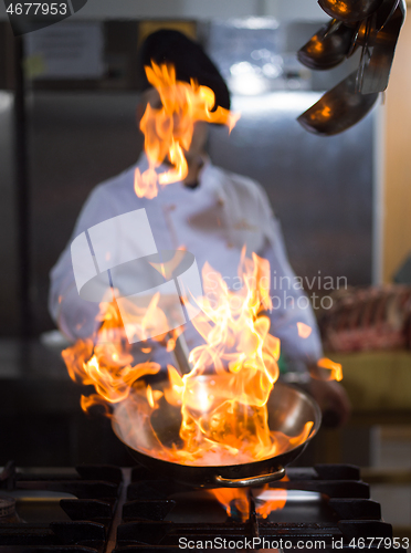 Image of Chef doing flambe on food