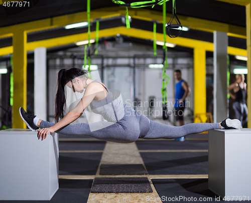 Image of woman working out gymnastic exercise on fit boxes