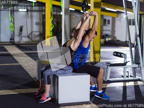 Image of athletes working out their arms