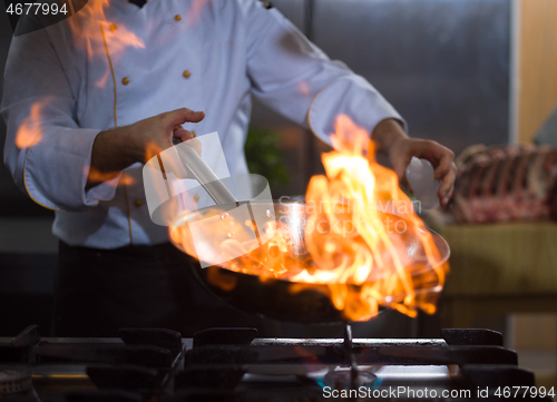 Image of Chef doing flambe on food