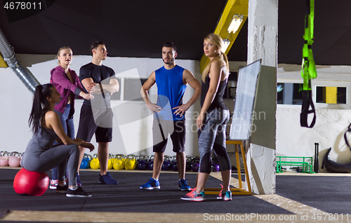 Image of athletes getting instructions from trainer