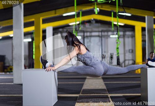 Image of woman working out gymnastic exercise on fit boxes