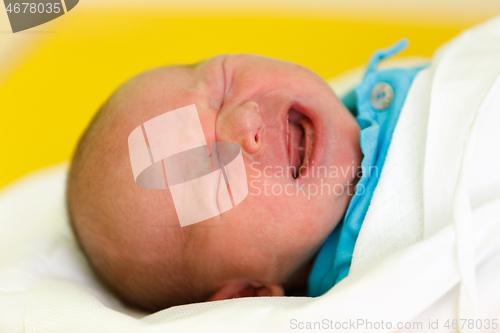 Image of crying newborn baby infant in the hospital