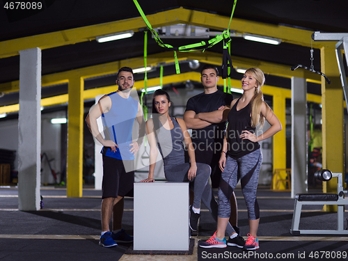 Image of portrait of athletes working out  jumping on fit box