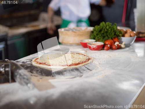 Image of raw pizza margarita