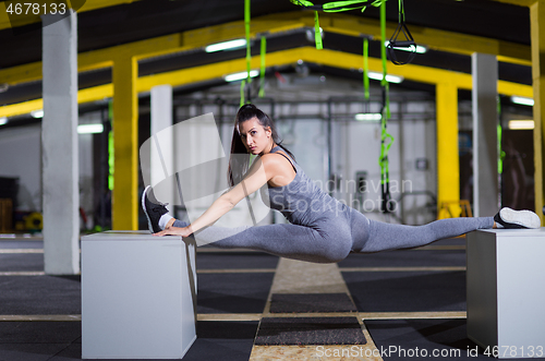 Image of woman working out gymnastic exercise on fit boxes