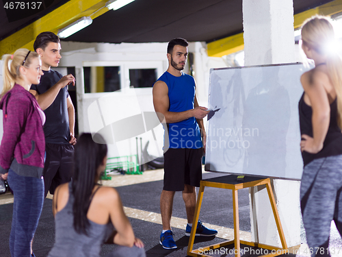 Image of athletes getting instructions from trainer