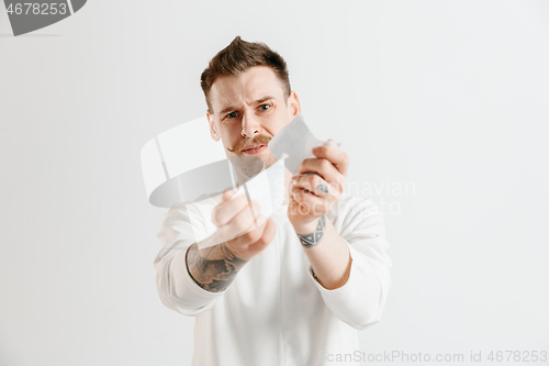 Image of Young man with a surprised expression won a bet