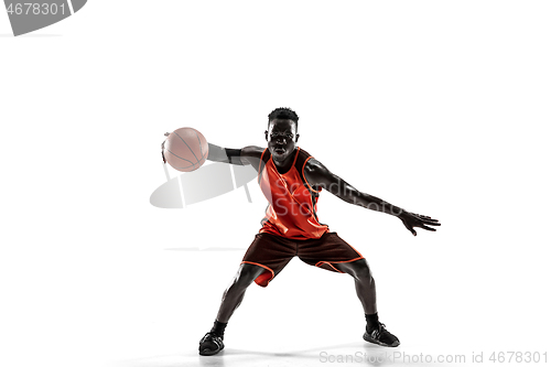 Image of Full length portrait of a basketball player with ball