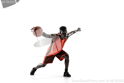 Image of Full length portrait of a basketball player with ball