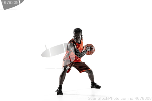 Image of Full length portrait of a basketball player with ball