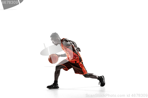 Image of Full length portrait of a basketball player with ball