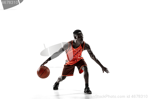 Image of Full length portrait of a basketball player with ball