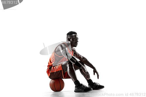 Image of Full length portrait of a basketball player with ball