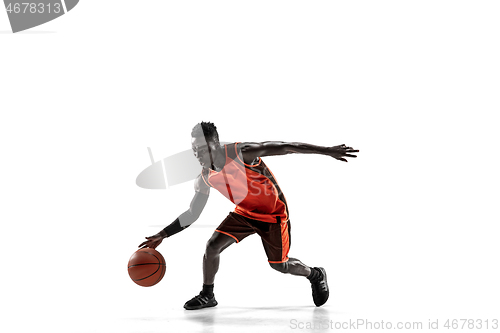 Image of Full length portrait of a basketball player with ball