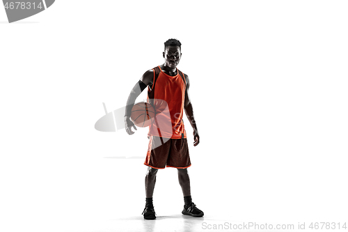 Image of Full length portrait of a basketball player with ball